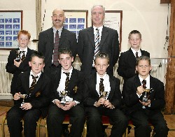 Mr. Raymond Cassidy, Guest Speaker congratulates last years winners of the Year 8 five-a-side football league. Included are Ryan Collins, Colm Fegan, Ross Flynn, Damien McKeown, Donal ONeill and Glenn Rice